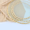 A round, gold-rimmed glass fruit platter details Picture